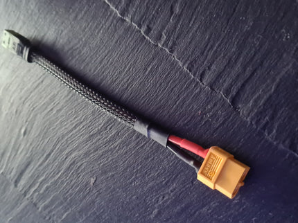 Electrical cable with connectors on a textured dark surface