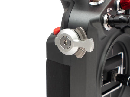 Close-up of a mechanical component with red and silver parts on a white background
