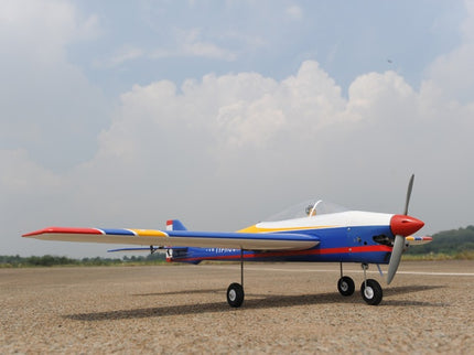 Phoenix Model TYPHOON 59" Size ARF Model airplane on a dirt field with a cloudy sky background