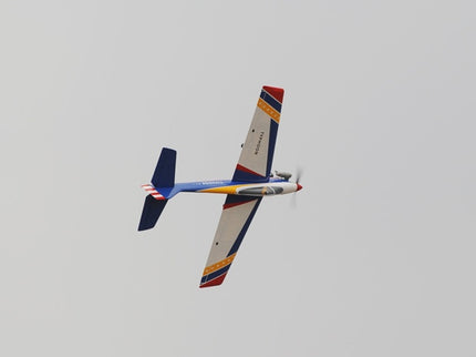 Colorful Phoenix Model TYPHOON 59" Size ARF airplane flying against a clear sky