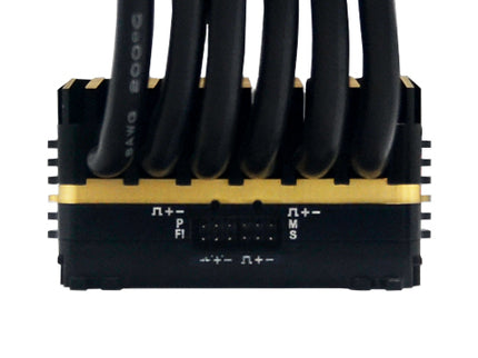 Black and yellow electronic component with multiple cables on a white background