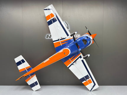 Model airplane with orange and blue design on a gray background