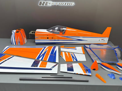 Model airplane parts on a gray surface with 'Revell' branding in the background.