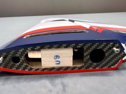 Model laser stabs with a carbon fiber pattern on a gray surface