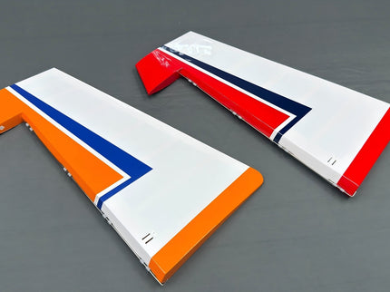 Two rudders with a red, white, and blue design on a gray background
