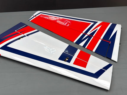 Two airplane wings with a red/blue design on a gray surface