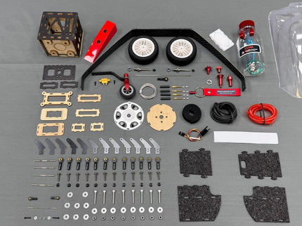 Collection of model building parts on a gray surface