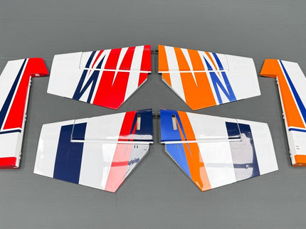 Set of airplane wing panels with red, white, and blue design on a gray background