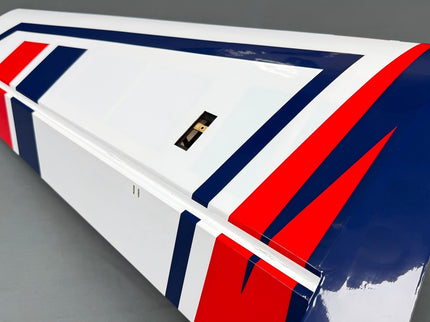 under wing with red, white, and blue design on a gray background