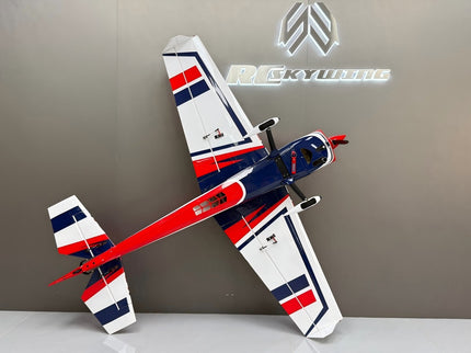 Model airplane with red, white, and blue design on a gray background with a logo.
