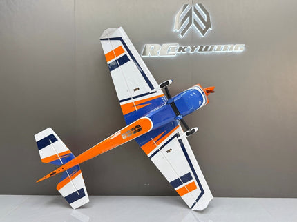 Model airplane with orange and blue design on a gray background