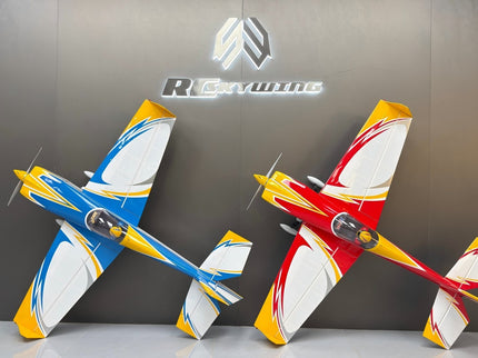 Two model airplanes on a gray surface with a branded background