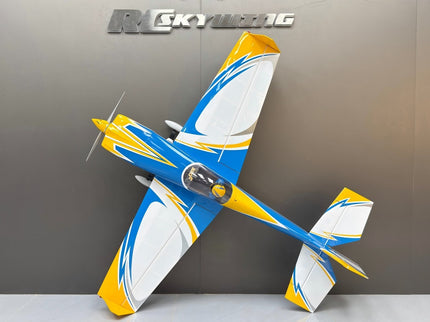 Model airplane with blue and yellow design on a gray background, featuring the brand 'RC Skywing '.