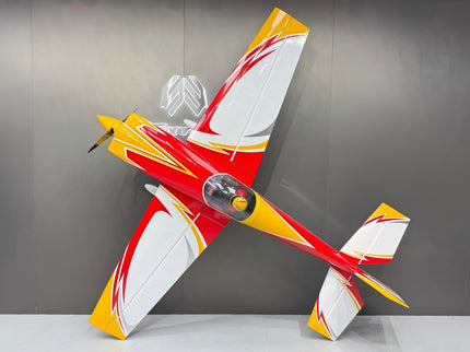 Model airplane with red and yellow design on a gray background