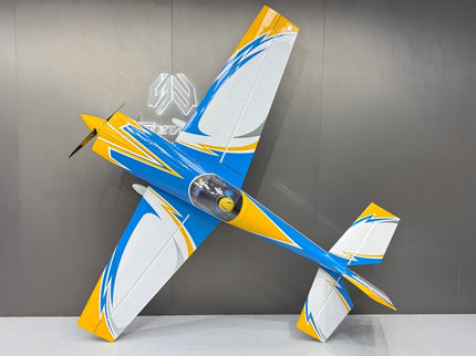 Model airplane with blue and yellow design on a gray background
