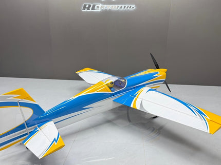 Model airplane with blue and yellow design on a gray background