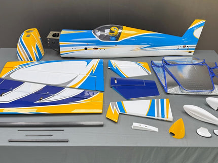 Model airplane kit with various parts on a gray surface