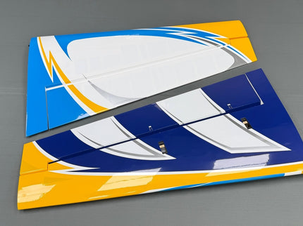 Colorful model airplane wing on a gray background