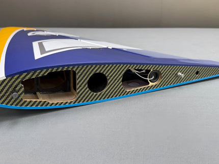 Carbon fiber winglet on a gray surface