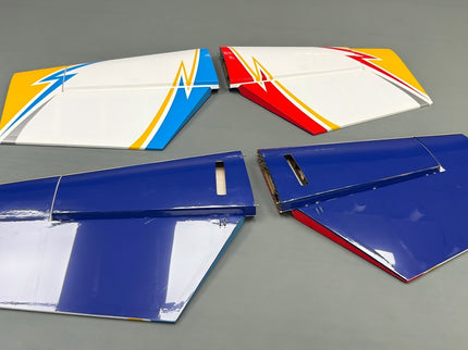 Set of colorful model airplane wings on a gray background