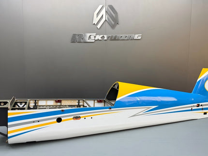 Model airplane with blue and yellow design on a gray surface, branded 'Racing' in the background.