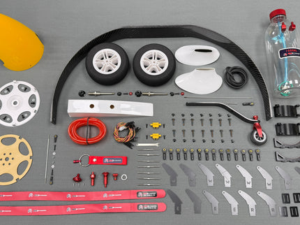 Collection of model building parts on a gray background