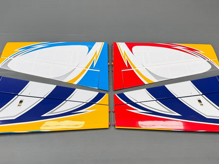Two colorful airplane wing models on a gray background