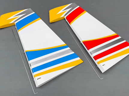 Two rudders striped with colorful stripes on a gray background