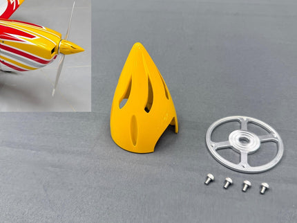 Yellow plastic spinnert, metal backplate, and screws on a gray surface with a model airplane inset.