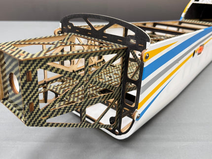 Model airplane with a detailed carbon fiber frame on a gray background