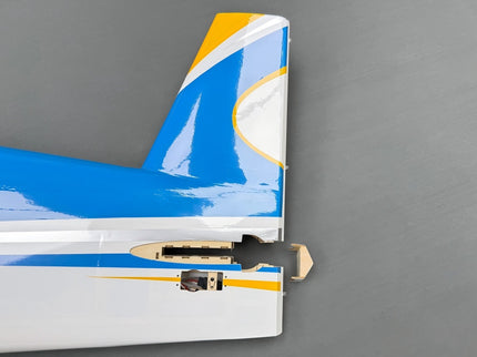 Close-up of an airplane's tail fin with a blue, white, and yellow design on a gray background