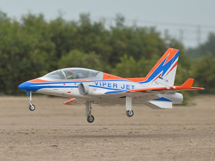Phoenix Model VIPER JET 83'' With Electric Retract ARF V2 Model airplane labeled 'Viper Jet' on a dirt surface with trees in the background