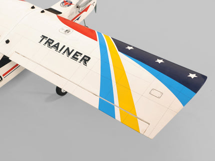 Phoenix Model Domino 62” Trainer Model airplane with 'Trainer' branding on a gray background