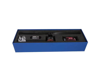 Blue display box with compartments containing small items on a white background