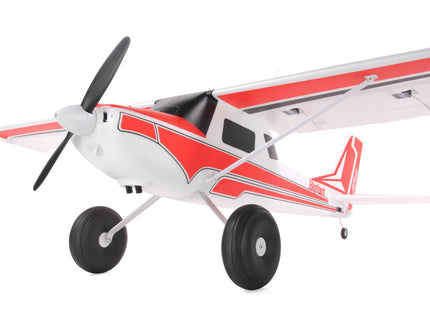Model airplane with red and white design on a white background