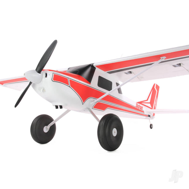 Model airplane with red and white design on a white background