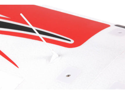 Close-up of a white and red car hood with a black logo on a white background