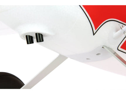 Close-up of a white ceiling light fixture with a red logo on a white background