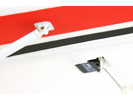Close-up of a car's hood with red and black stripes on a white background