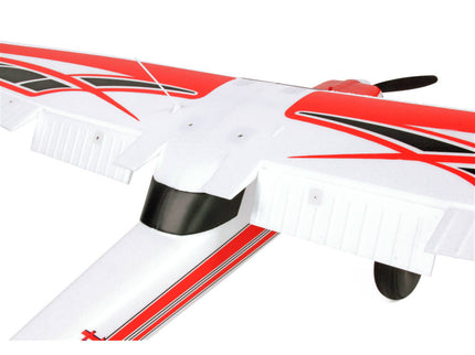 White and red model airplane on a white background