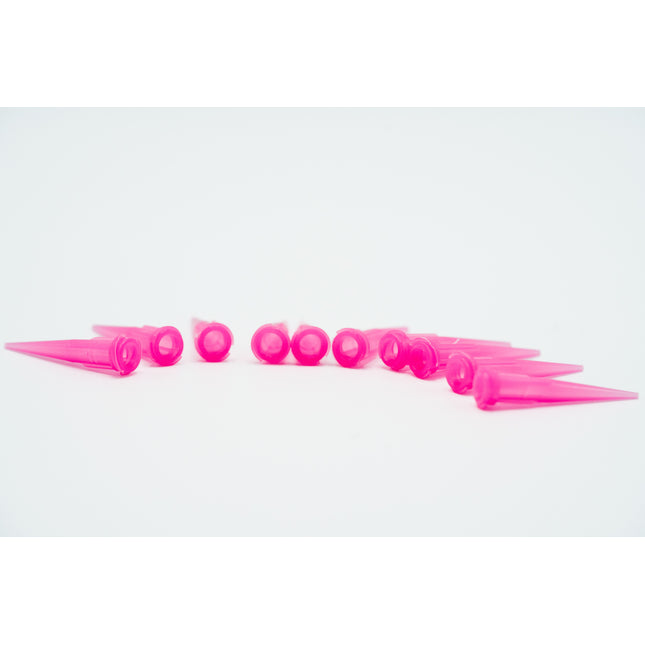 Row of pink plastic cones on a white background