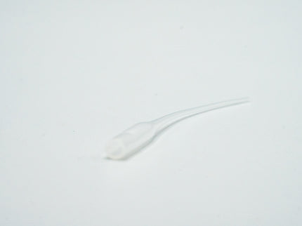 White spoon on a light gray background