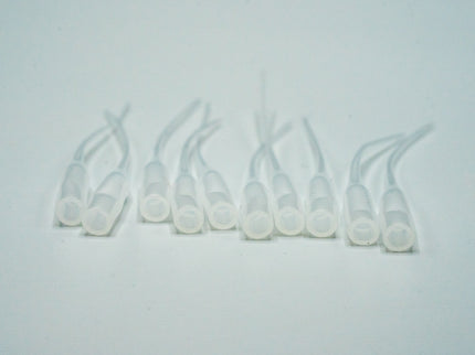 Set of clear plastic connectors on a light gray background