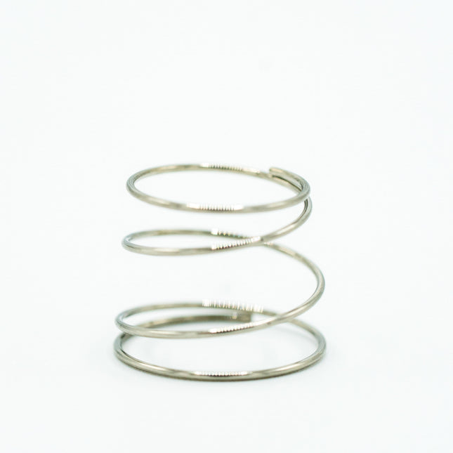 Silver spiral spring on a white background