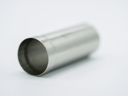 Metallic cylindrical object on a light gray background