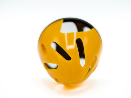 Yellow and black object with cut-out design on a white background