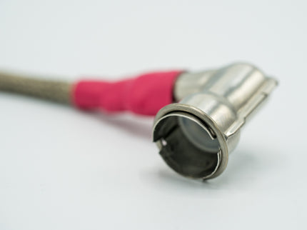 Metallic garden hose nozzle with pink rubber on a white background