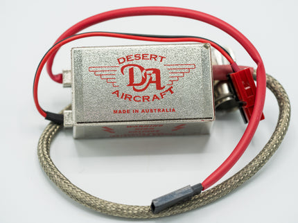 Desert Aircraft electronic component with red wiring on a white background