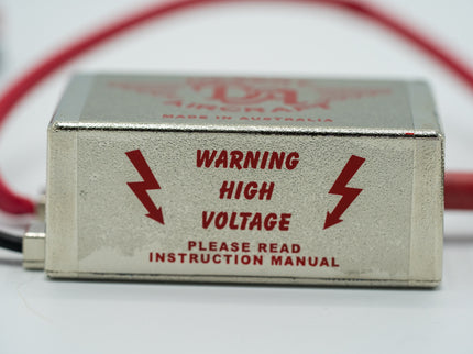High voltage warning device with red text on a white background