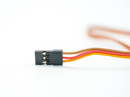 Black electronic connector with multicolored wires on a white background